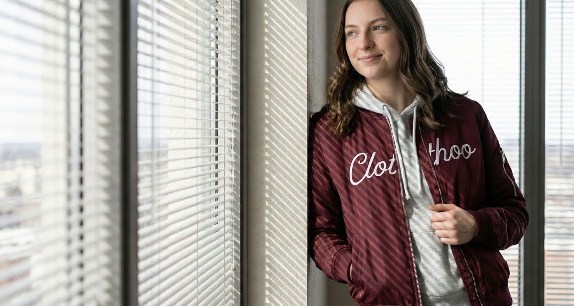 maroon-bomber-jacket-over-gray-hoodie-1920x1024.jpg